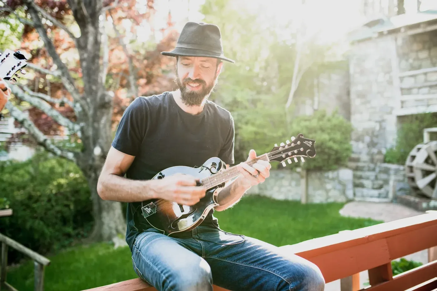 Ryan Price, producer of The Winter Ramble, playing mandolin outdoors