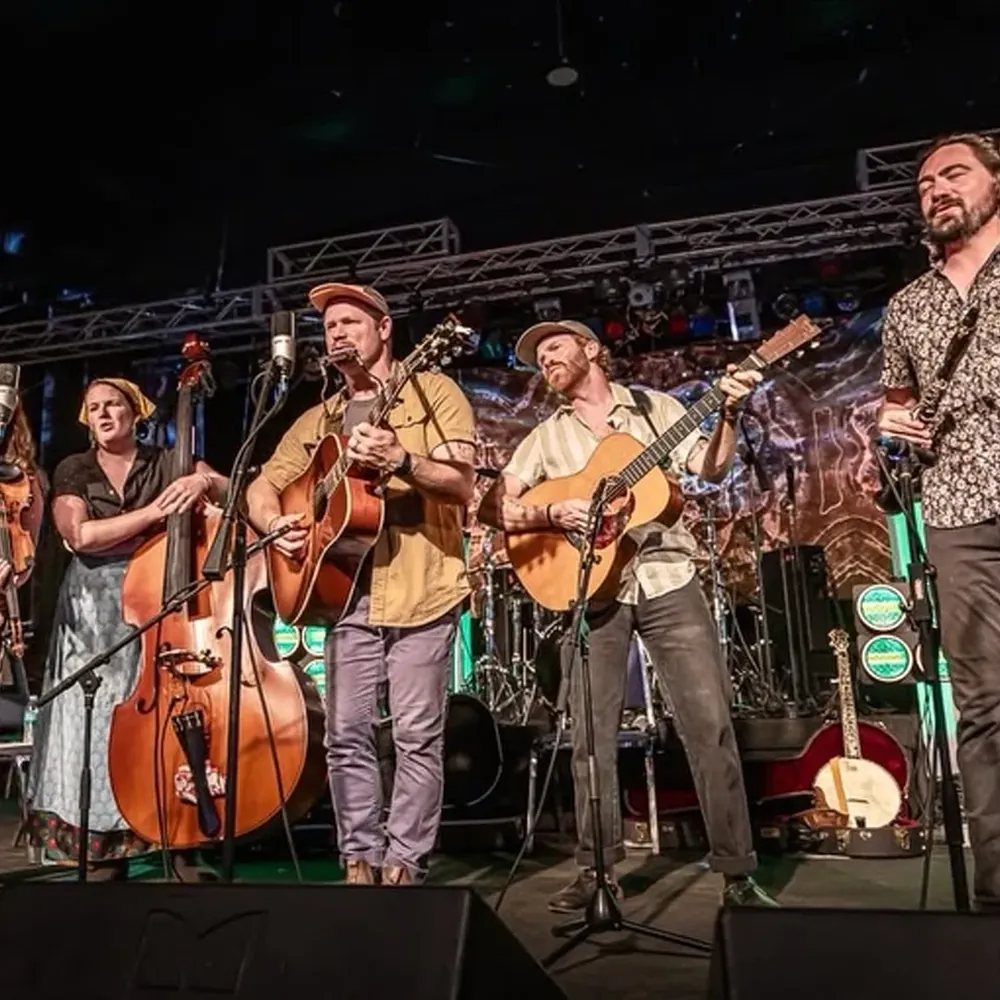 A string band performing on an outdoor stage